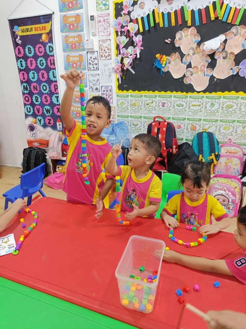 Toddlers playing on indoor playground at Little Darwisy